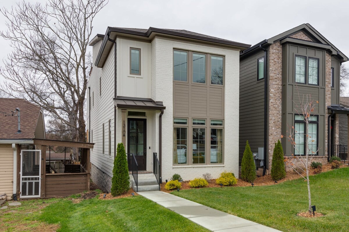 Manicured front lawn invites you into the Lyric