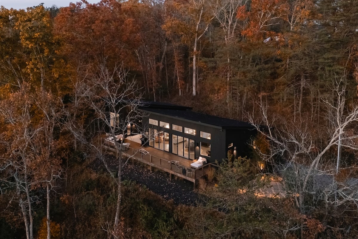 {Aerial View} Soar above Glass House—modern luxury set against Asheville’s stunning peaks.