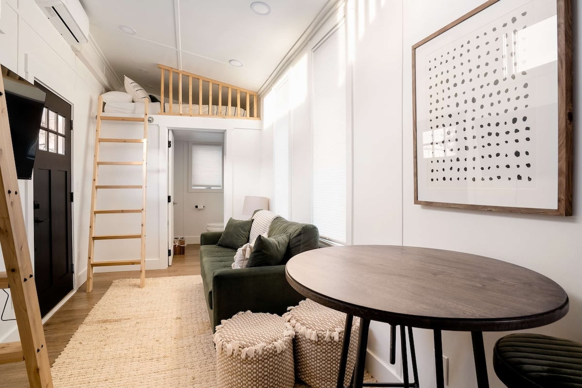 CAPTION:
Discover "Property," a modern haven in Portland, US. This luxurious travel property boasts a sleek minimalist design featuring clean lines and neutral tones. The light-filled interior, with its white walls and natural wood accents, creates a serene ambiance. Key visual highlights include an inviting loft space and chic furnishings. Ideal for discerning travelers seeking tranquility and style, this sophisticated escape blends contemporary aesthetics with comfort, offering an unforgettable stay experience.