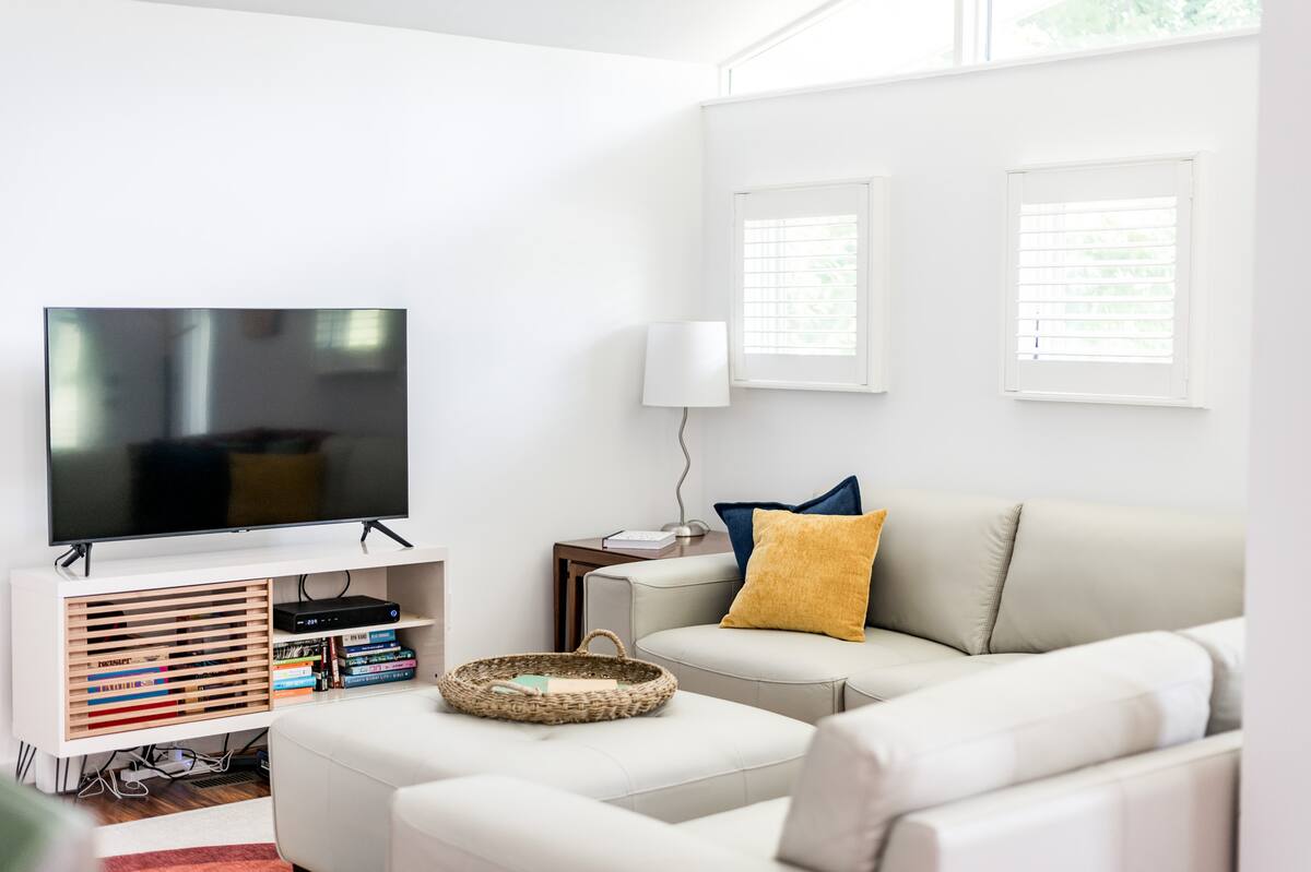 Smart TV that has streaming apps like Netflix, live channels, and cable, 2 karaoke mics to belt out your favorite tunes, games, and books.