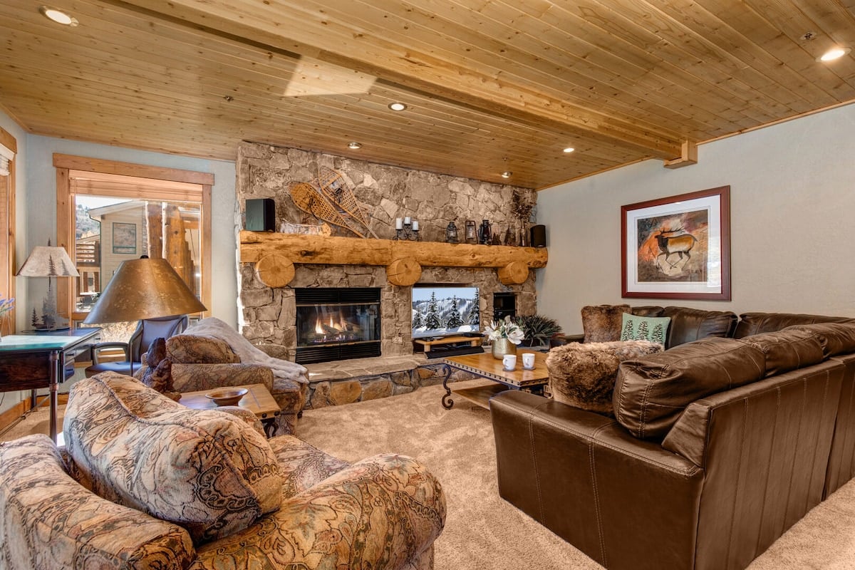 **CAPTION**: Nestled in the scenic landscapes of Park City, "Property" boasts a rustic yet luxurious architectural style, offering a warm and inviting atmosphere. The cozy living area features a stone fireplace flanked by rich wooden beams and leather couches, exuding a classic mountain lodge vibe. Earthy tones and textured fabrics enhance the cozy warmth, making it an ideal retreat for travelers seeking upscale comfort surrounded by nature’s beauty.

2. **META DESCRIPTION**: "Property - Rustic stone fireplace lounge | Book at Journey.com"