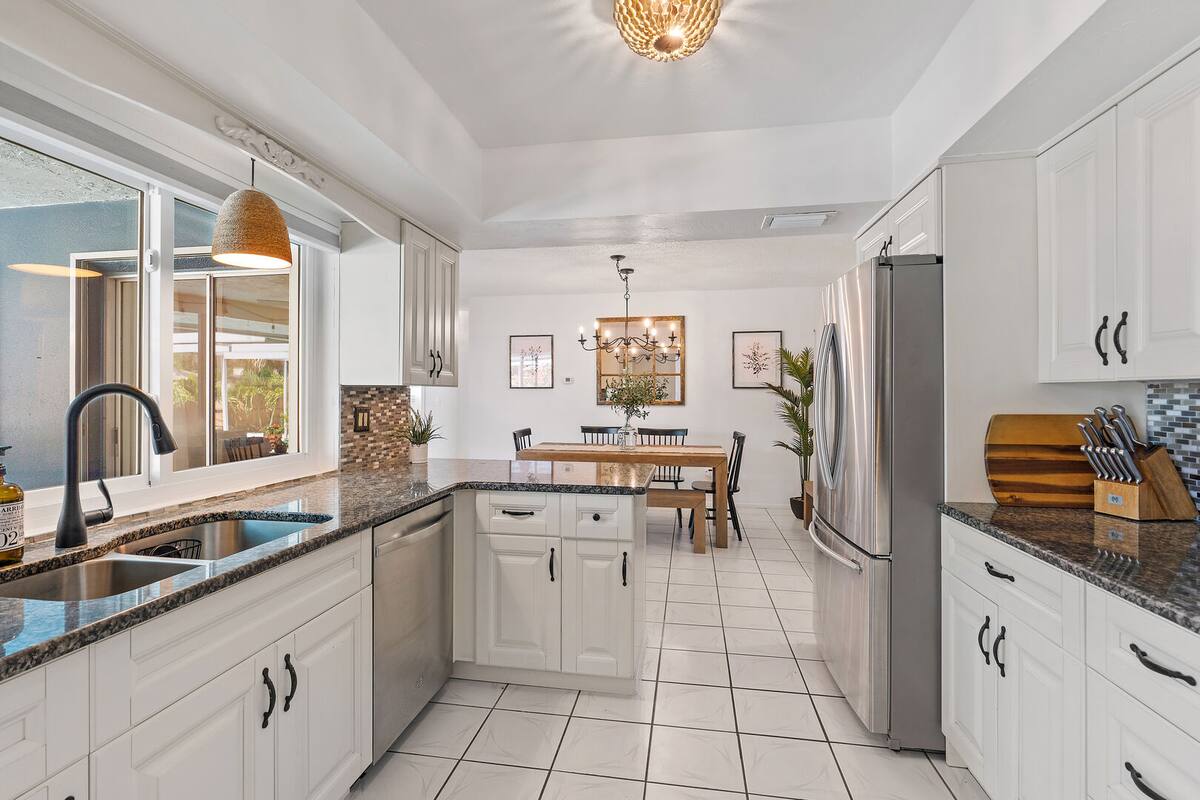 Open concept kitchen w/ plenty of cabinets.