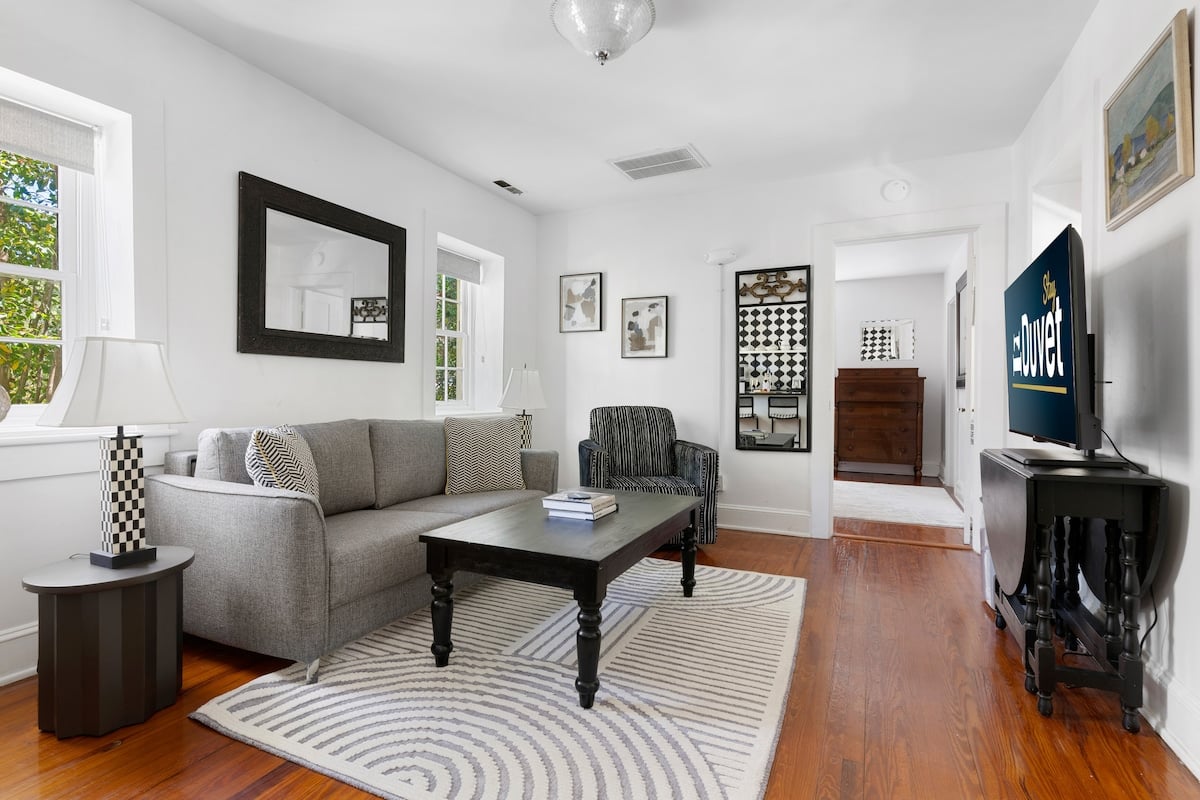 CAPTION:
Discover refined comfort and timeless charm at "Property" in Charleston, US. This luxury travel property showcases a blend of modern and traditional architectural styles, with a serene and inviting atmosphere. The interior boasts bright, airy rooms featuring a soothing neutral palette with pops of classic black and white. Elegant furnishings and tasteful decor create a relaxing ambiance, appealing to sophisticated travelers seeking a peaceful retreat in a historical city.
