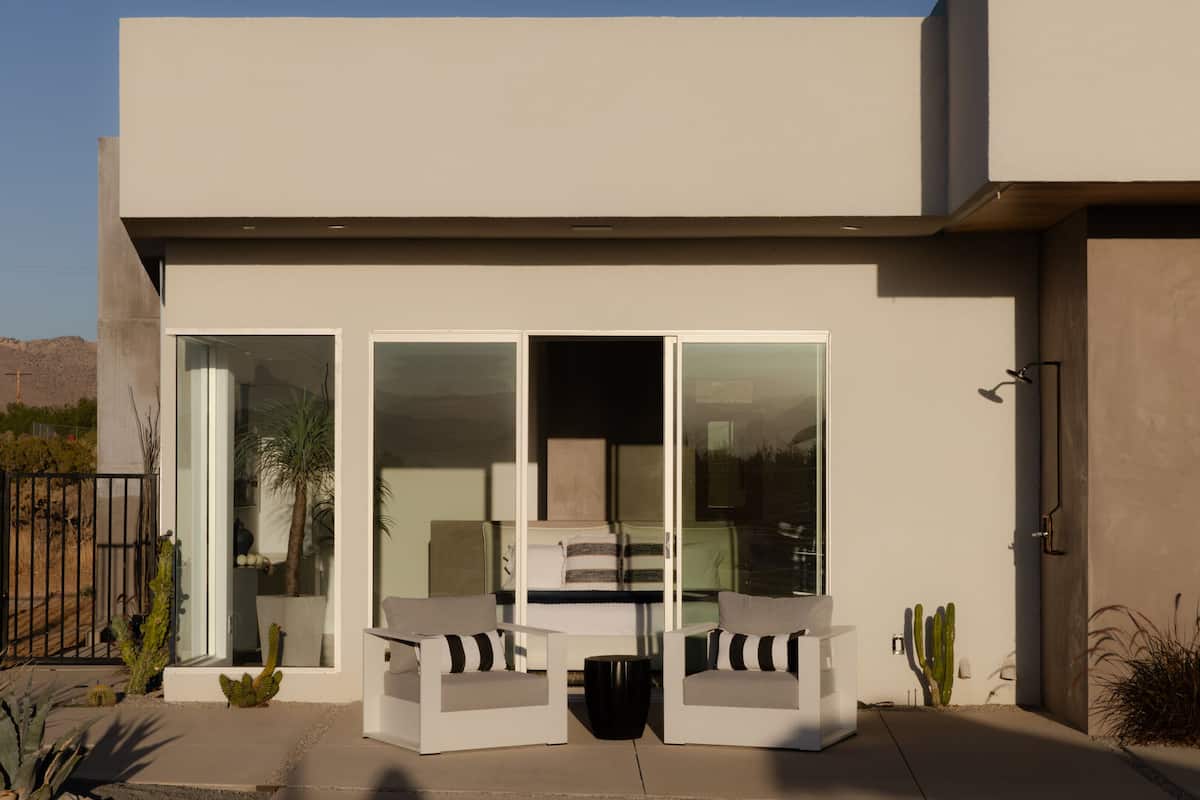 Seating area outside the primary bedroom and outdoor shower.