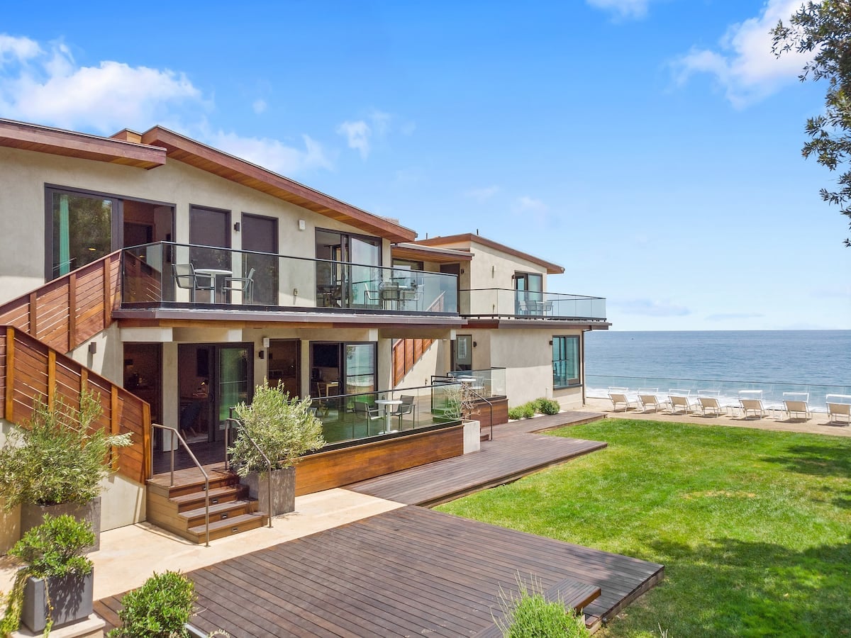 A grassy area is the perfect place to do morning yoga while overlooking the ocean