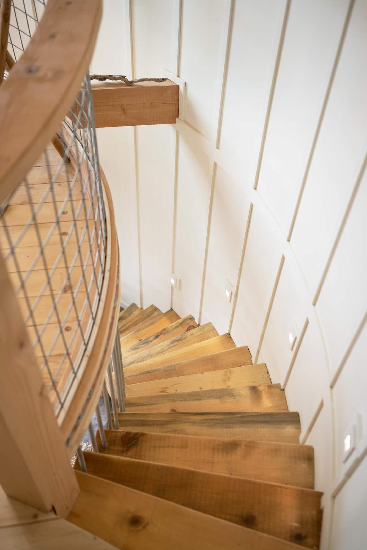 Curved stairway leading to the loft bedroom