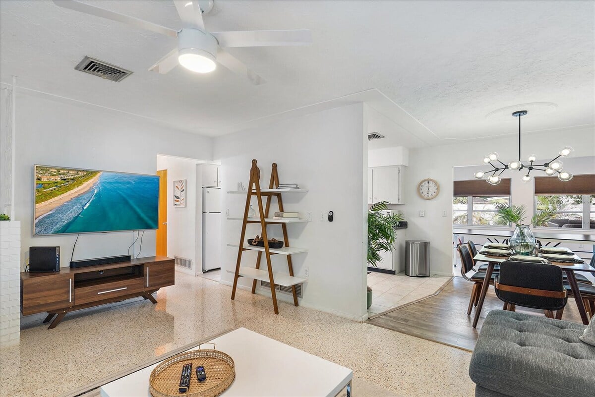 The living room area flows into the dining area, perfect for hosting friends and family!