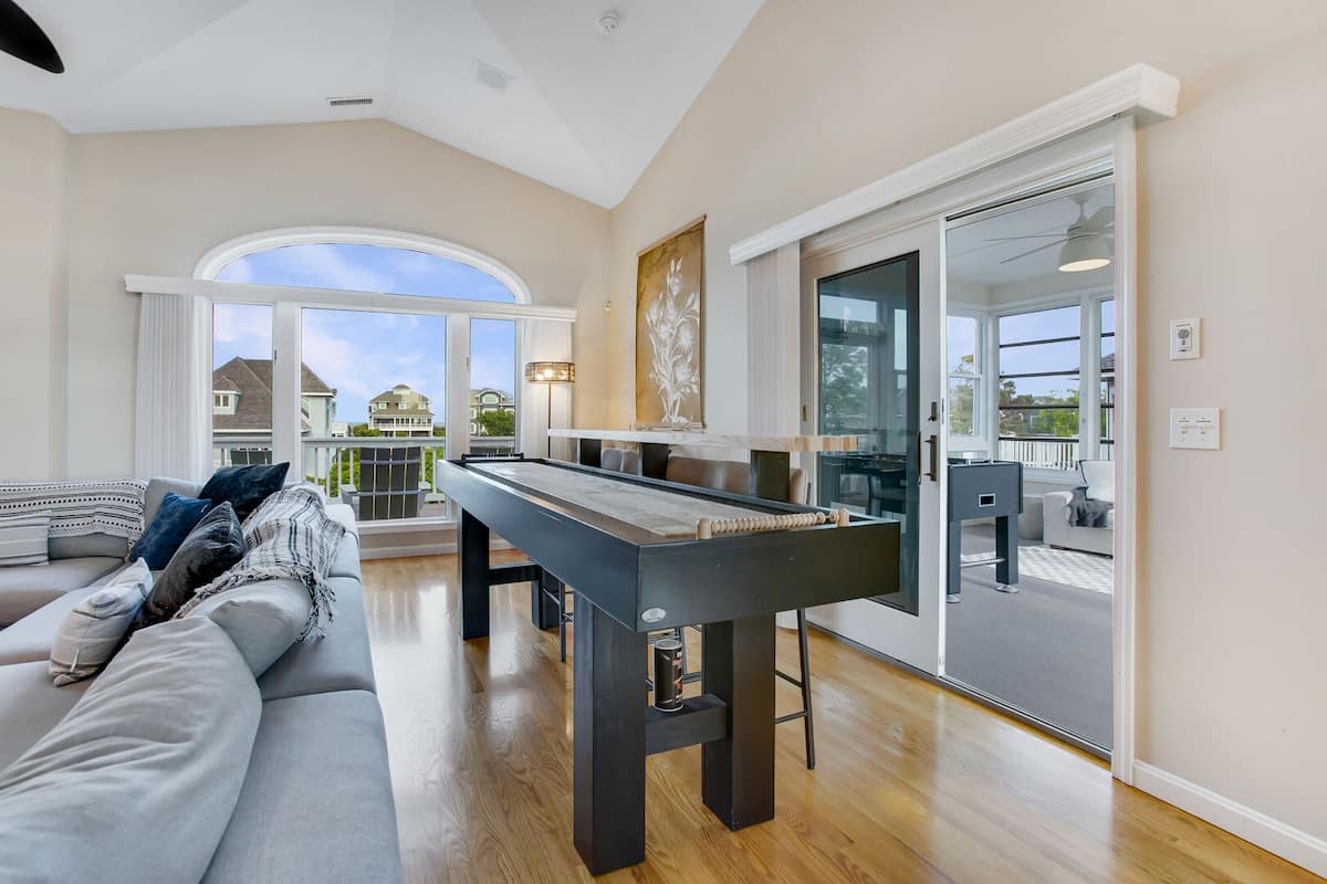 Enjoy a game on one of the multiple game tables that this home has to offer!