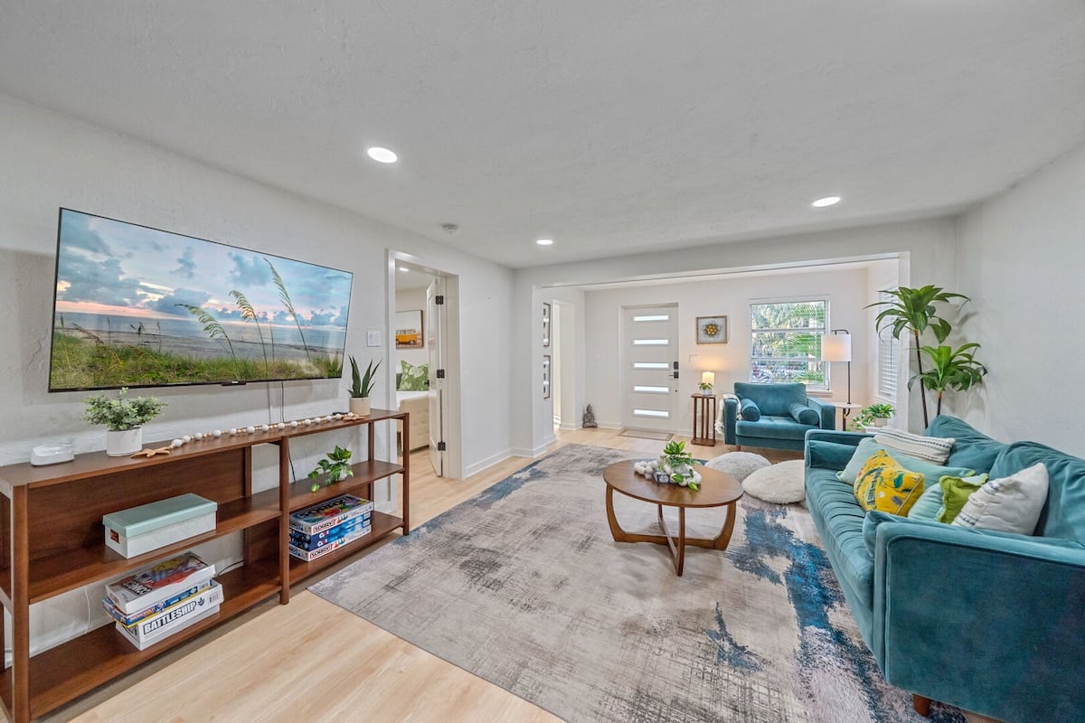 House 1 - Smart TV located over modern shelving! Sign into your preferred streaming service to catch up on all of your favorite shows while on vacation.