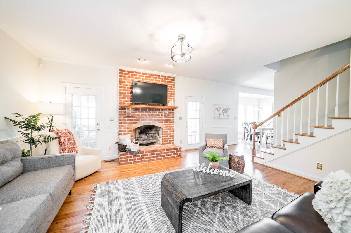 Living area opens up into sunroom, breakfast area, and kitchen.