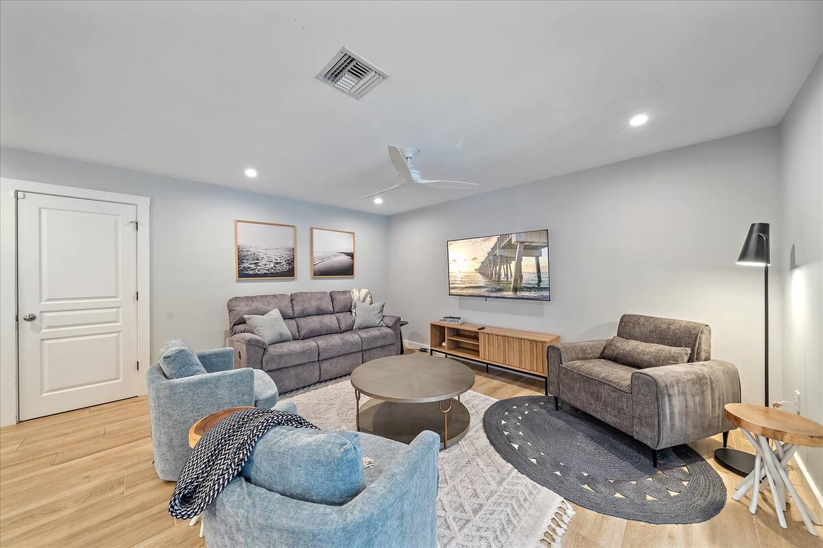 There's plenty of comfortable seating for everyone in your group! The corner chair is the ideal morning coffee spot!