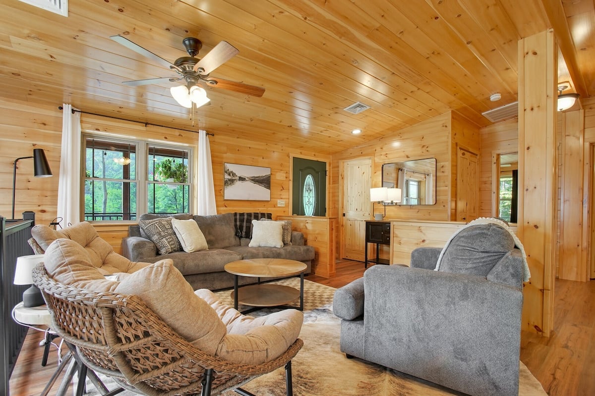 Gather as a family in the upstairs living room where cozy and comfy seating is not in short supply!