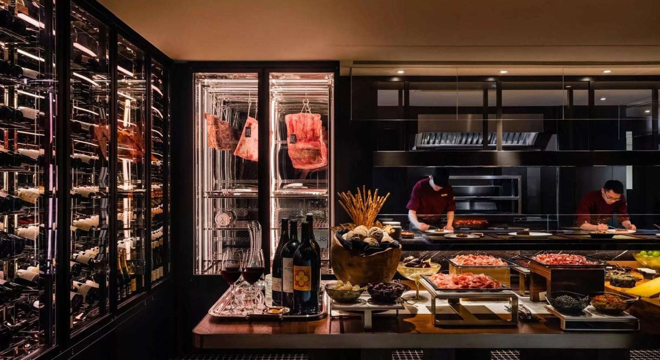 Climate-controlled wine towers and dry-aged beef displays create theater at this sophisticated steakhouse, where chefs craft premium cuts behind gleaming glass counters.