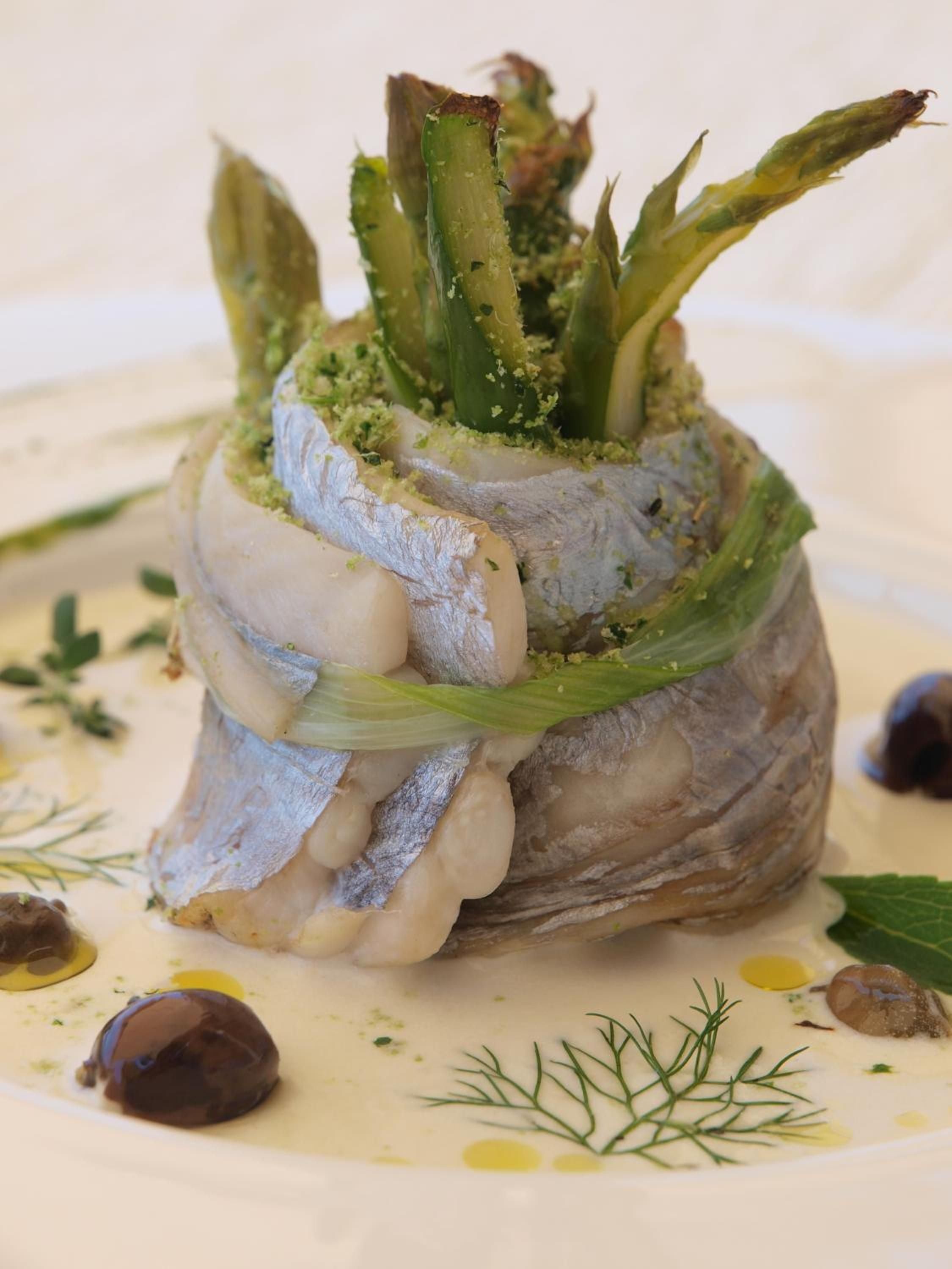 Artfully plated vegetables crowned with vibrant greens showcase the resort's commitment to Mediterranean cuisine, where seasonal ingredients meet sophisticated presentation in every thoughtfully composed dish.