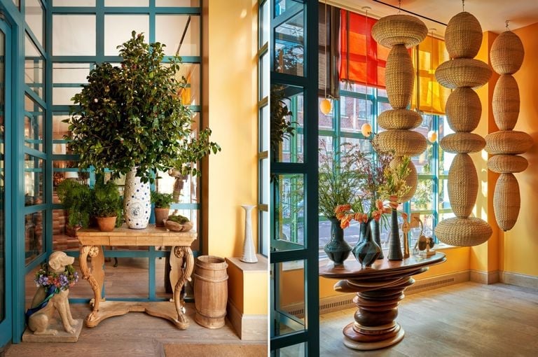 Woven pendant lights cascade like sculptural clouds while vibrant stained glass and potted greenery create an inviting bohemian sanctuary in the hotel's thoughtfully curated common spaces.