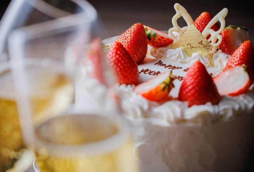 Delicate strawberry cake adorned with white chocolate butterflies showcases the exquisite attention to detail that defines Takinoyu's culinary artistry and celebration of seasonal Japanese ingredients.