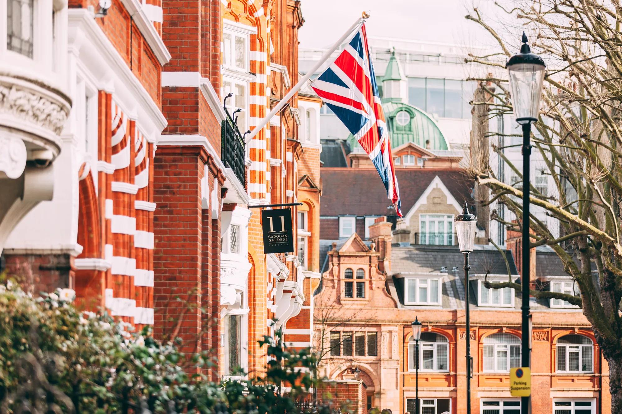 Red-brick Victorian elegance defines this Chelsea sanctuary, where Union Jack bunting and heritage architecture create an unmistakably British tableau along leafy Cadogan Gardens.