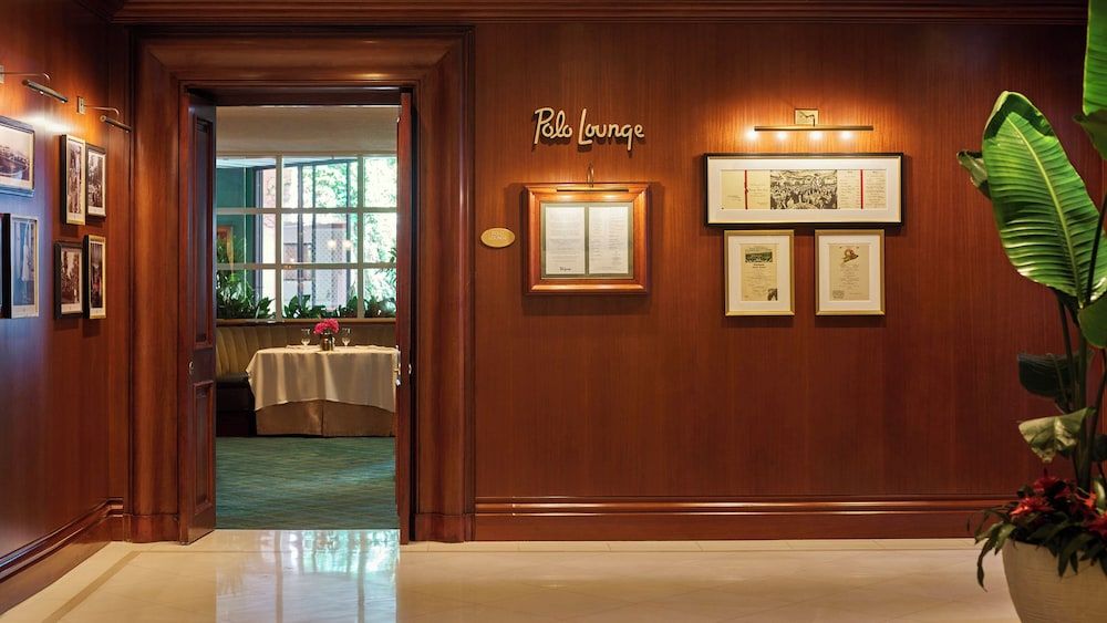 Rich mahogany paneling and polished marble floors create an intimate passage to the Polo Lounge, where Hollywood legends have dined for decades.