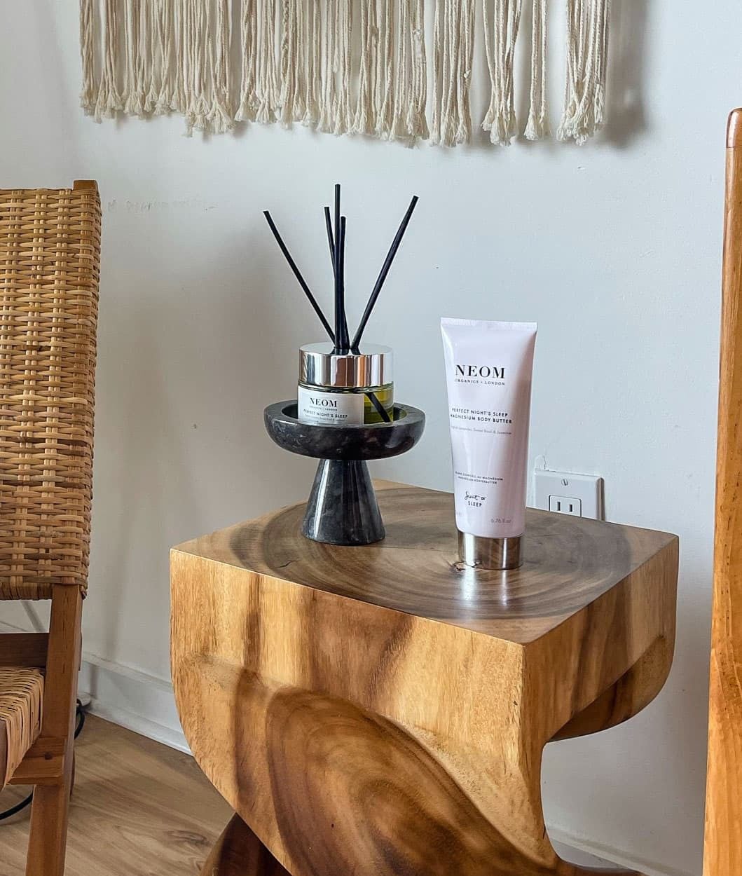 Natural textures define intimate spaces where sculptural wood furniture meets artisanal wellness products, creating serene moments of luxury within thoughtfully curated guest accommodations.