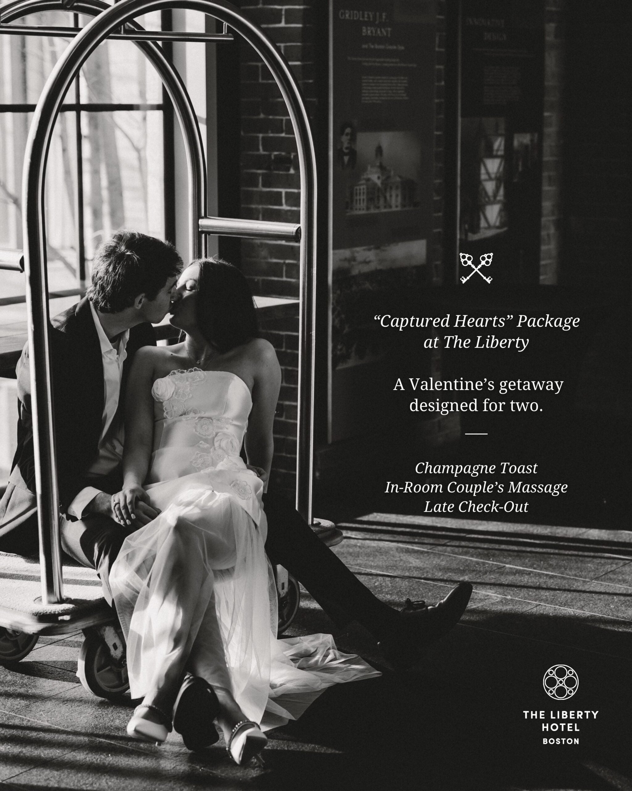 Newlyweds steal an intimate moment on the hotel's brass luggage cart, where historic brick walls and golden light create an unexpectedly romantic urban sanctuary.