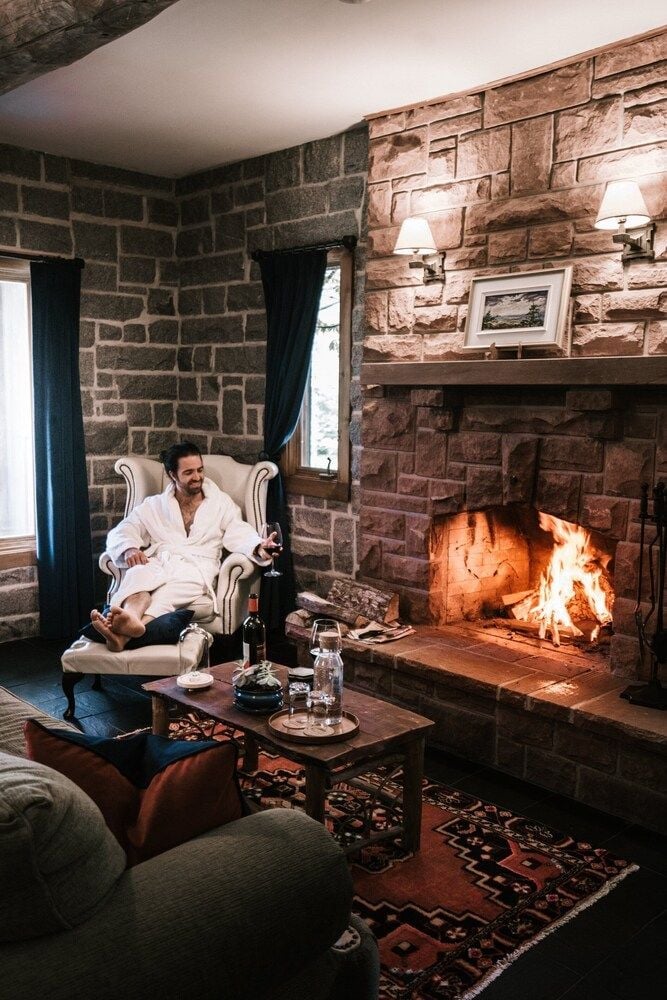 Stone walls echo centuries of Maritime history while flames dance in the grand fireplace, creating an intimate sanctuary for evening whiskey and contemplation.