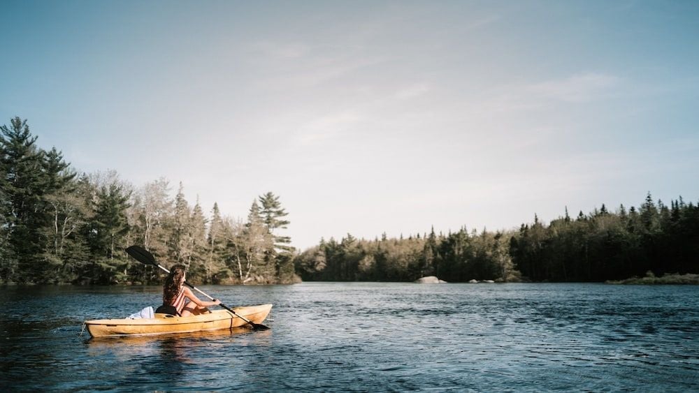 Gliding across mirror-still waters in a handcrafted kayak, guests discover the untouched wilderness that makes this Nova Scotia retreat so enchanting.