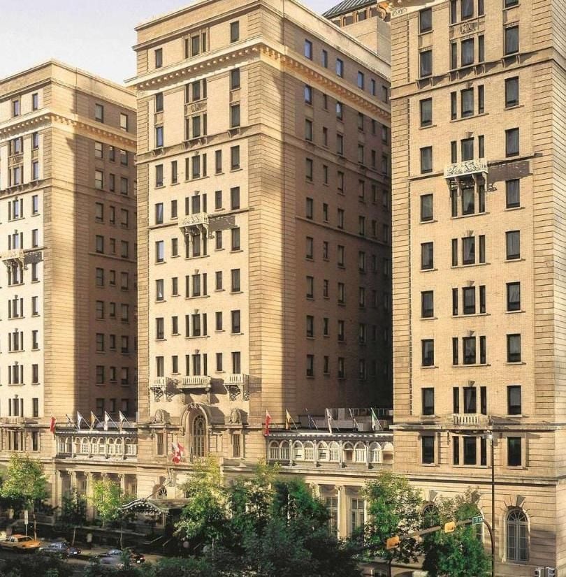 Historic limestone towers rise majestically above downtown Calgary, their classical facades and ornate balconies echoing the grandeur of railway hotels from a golden age.