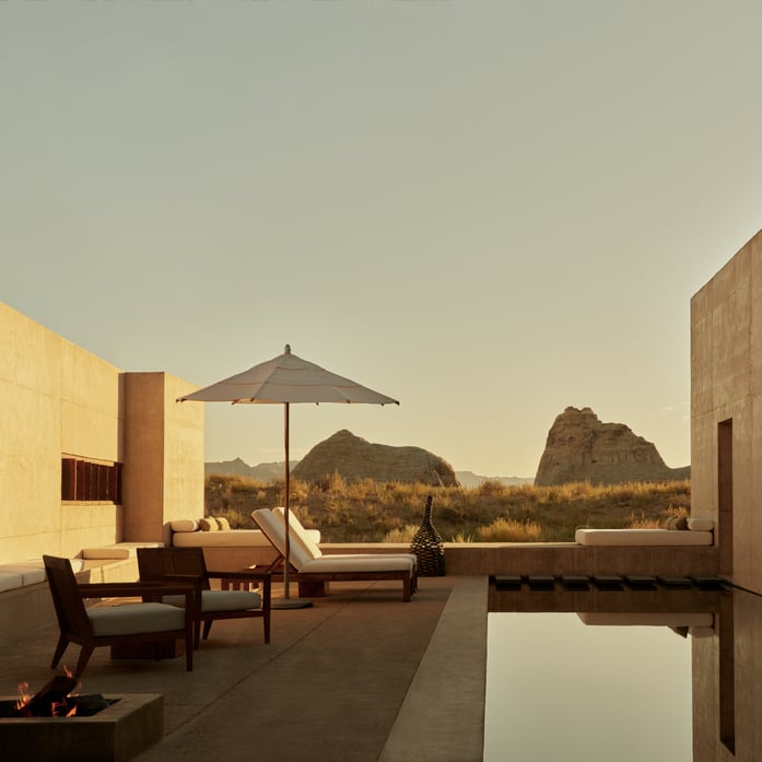 Desert light bathes minimalist terraces where infinity pools mirror Utah's ancient mesas, creating seamless dialogue between contemporary luxury and timeless sandstone formations.