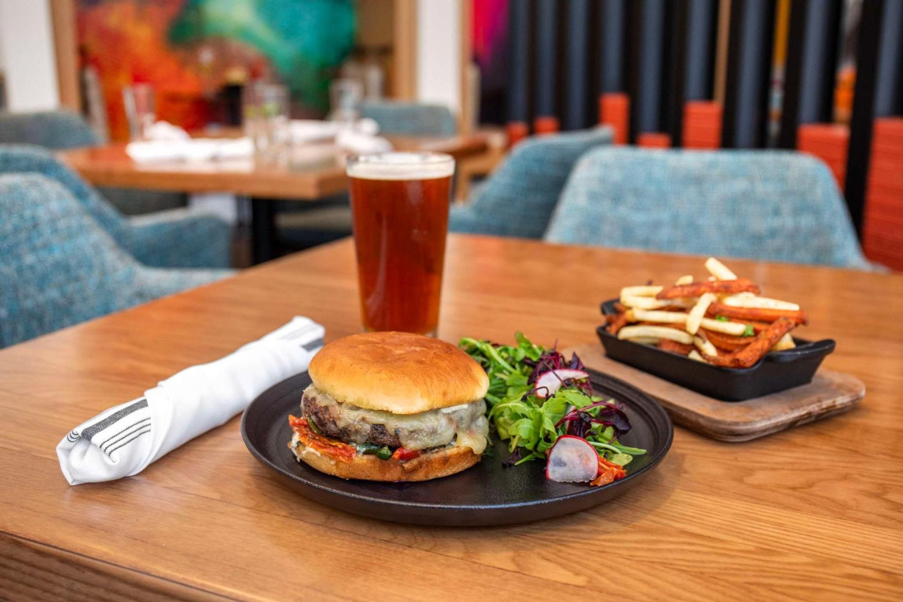Craft beer and gourmet burgers create perfect harmony in RiNo's industrial-chic dining scene, where locally-sourced ingredients meet Denver's vibrant brewing culture.