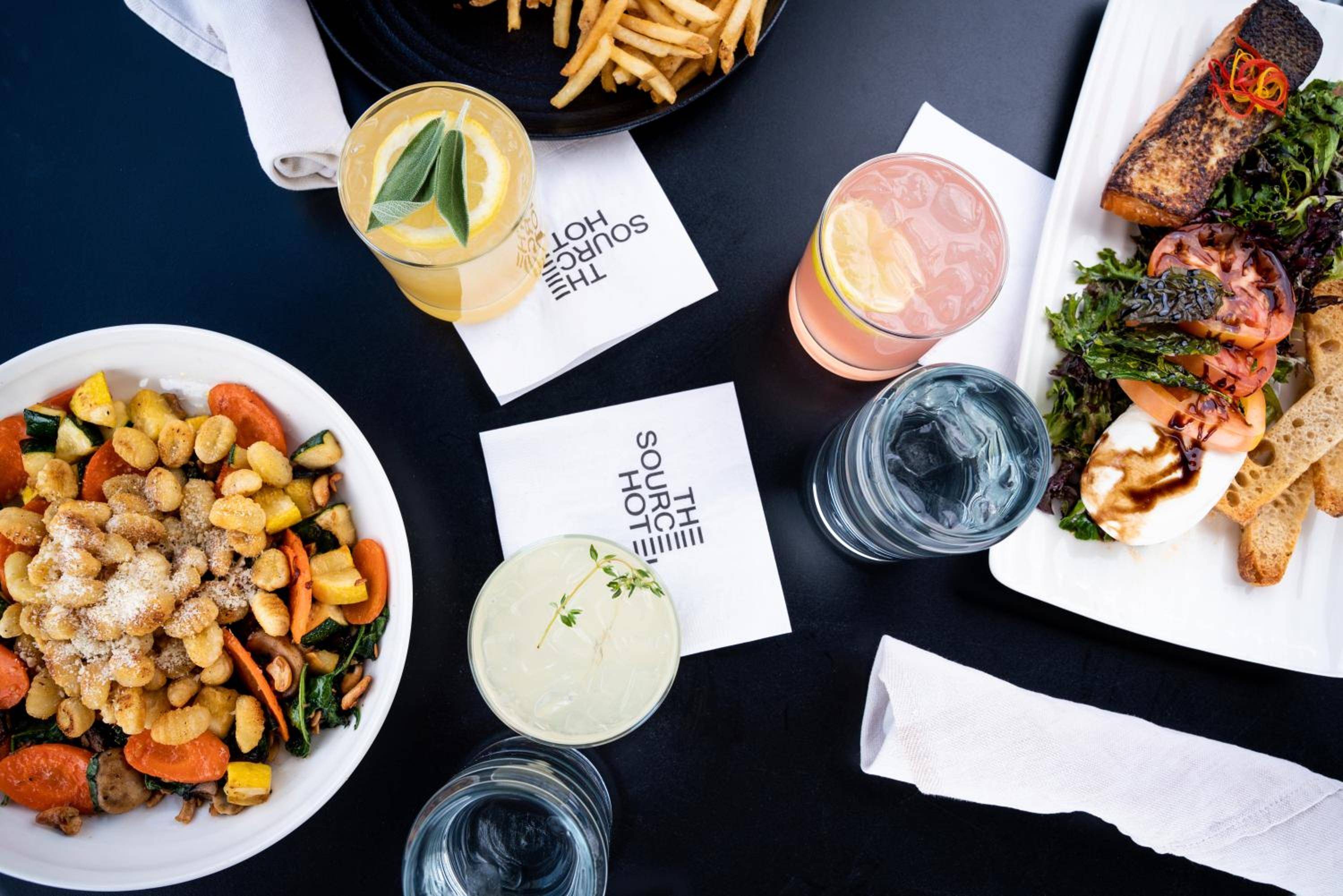 Artfully crafted cocktails and elevated comfort food create an intimate dining scene, where golden-hued drinks and house-made gnocchi invite lingering conversations over shared plates.