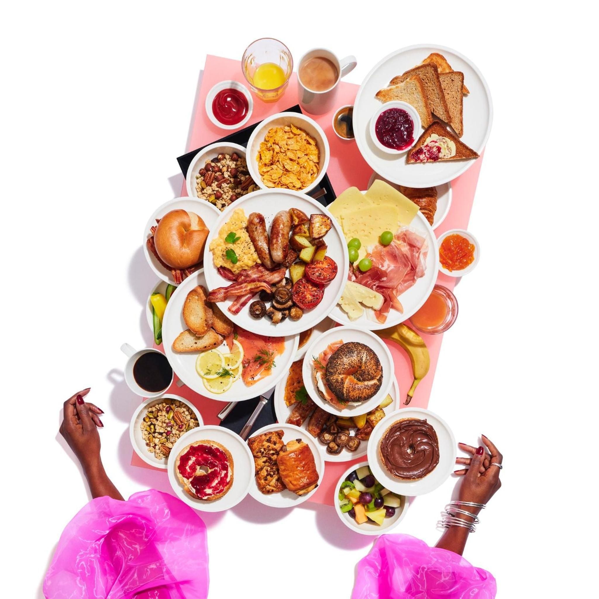 Abundant breakfast spreads showcase artisanal touches—house-made jams, fresh bagels, and carefully curated charcuterie create an inviting morning ritual that feels both indulgent and thoughtfully crafted.