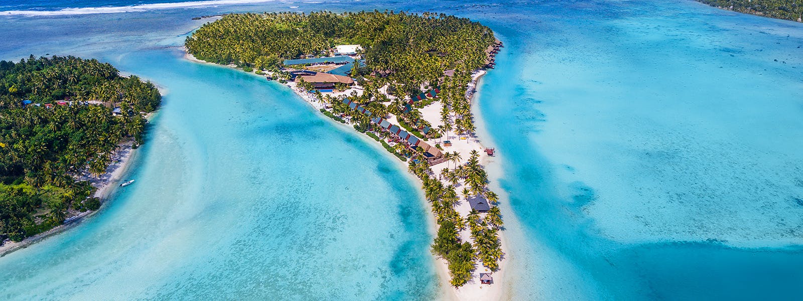 Turquoise lagoons embrace this secluded resort where overwater bungalows and palm-fringed beaches create an intimate South Pacific sanctuary surrounded by crystalline waters.
