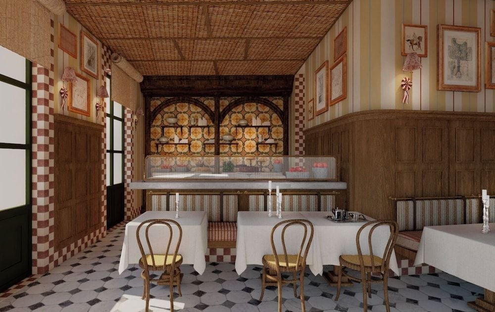 Warm wicker ceilings and checkered tile floors create an intimate dining atmosphere, where rustic charm meets refined hospitality in this cozy restaurant corner.