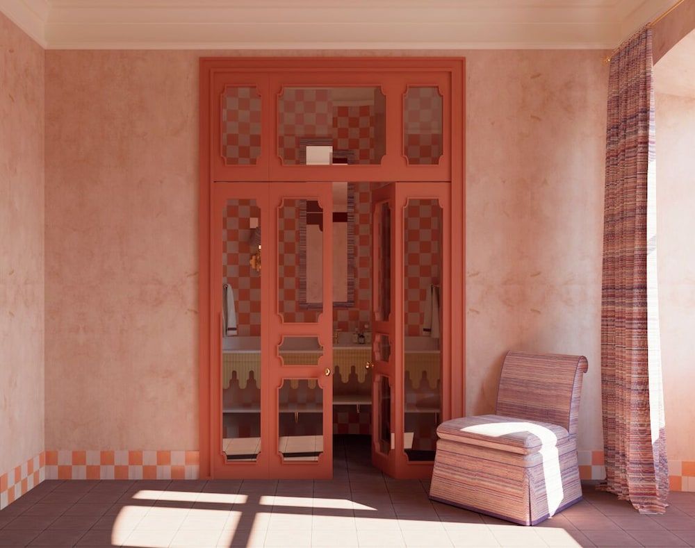 Terracotta hues envelop the spa's tranquil sanctuary, where hand-woven textures and geometric glass doors filter golden light into this serene wellness retreat.