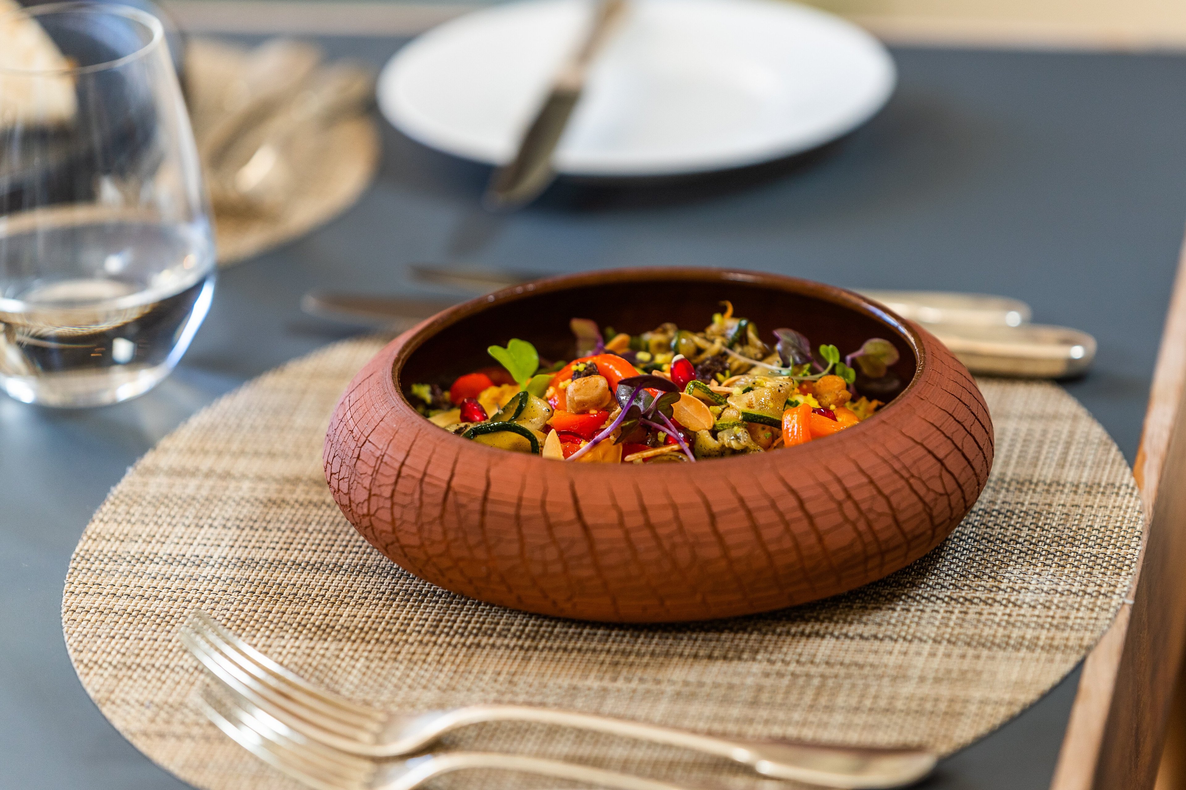 Farm-fresh vegetables glisten in handcrafted ceramic bowls, where Cape Town's Mediterranean climate translates into vibrant, locally-sourced dishes that celebrate the region's abundant produce.