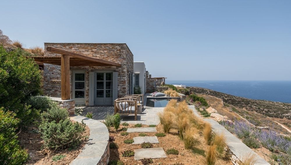 Where Sifnos meets the sky at the edge of a whitewashed village in Sifnos, Greece