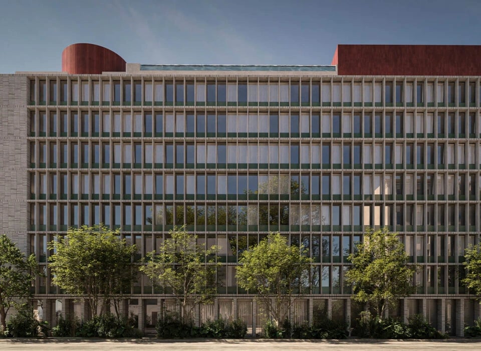 Pendry Manhattan West's striking facade showcases contemporary urban architecture with its rhythmic glass grid and warm brick base, framed by thoughtfully landscaped street-level greenery.