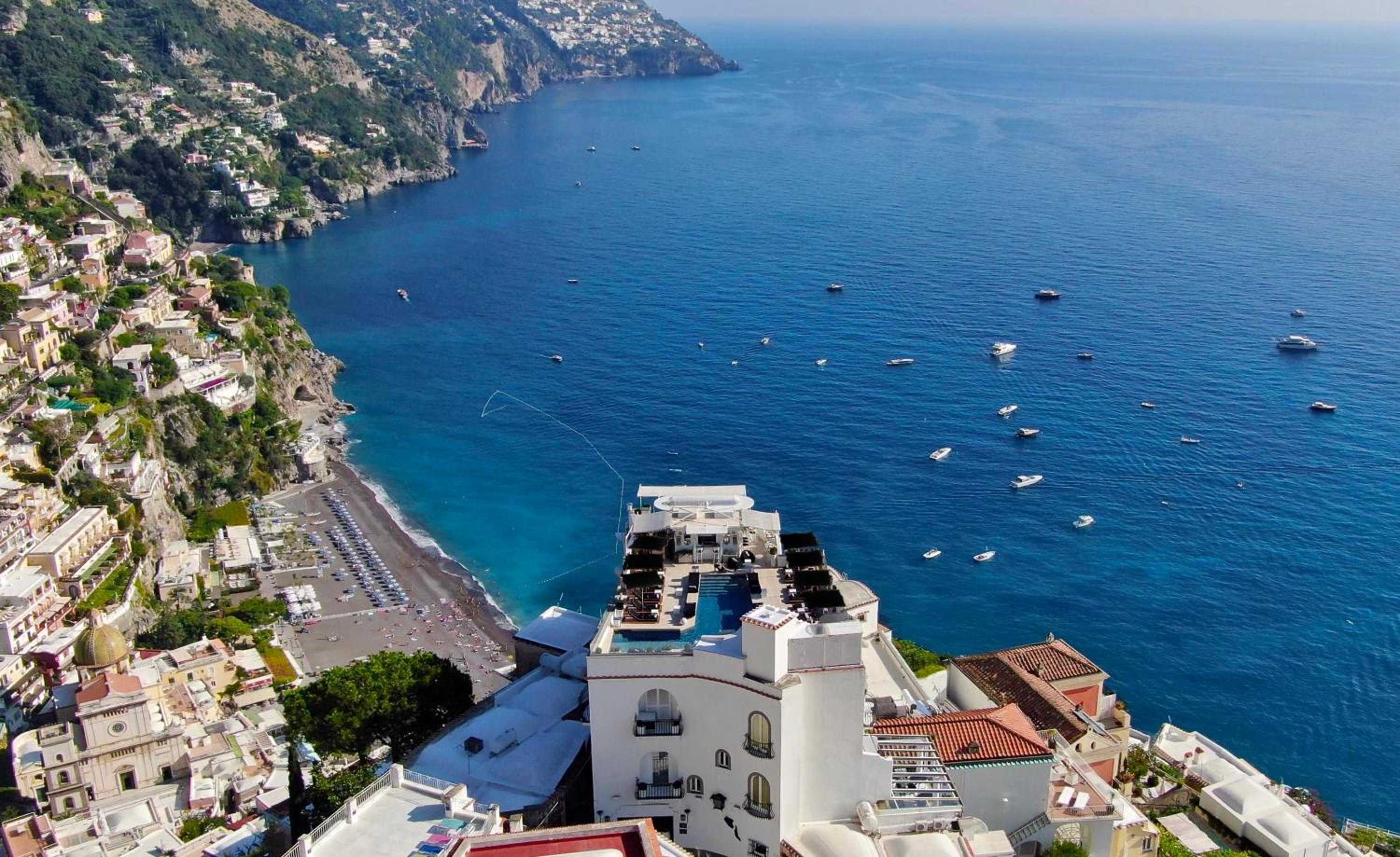 Perched dramatically above Positano's pebbly shore, this clifftop sanctuary commands breathtaking views of the sapphire Tyrrhenian Sea dotted with bobbing pleasure craft.