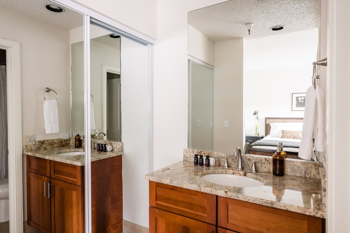 Bedroom 2's ensuite with a shower/tub.