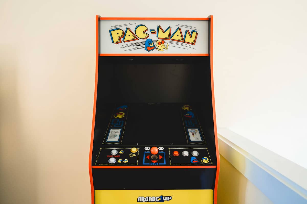 This living room comes with an arcade game, perfect for nostalgic fun and friendly competition.
