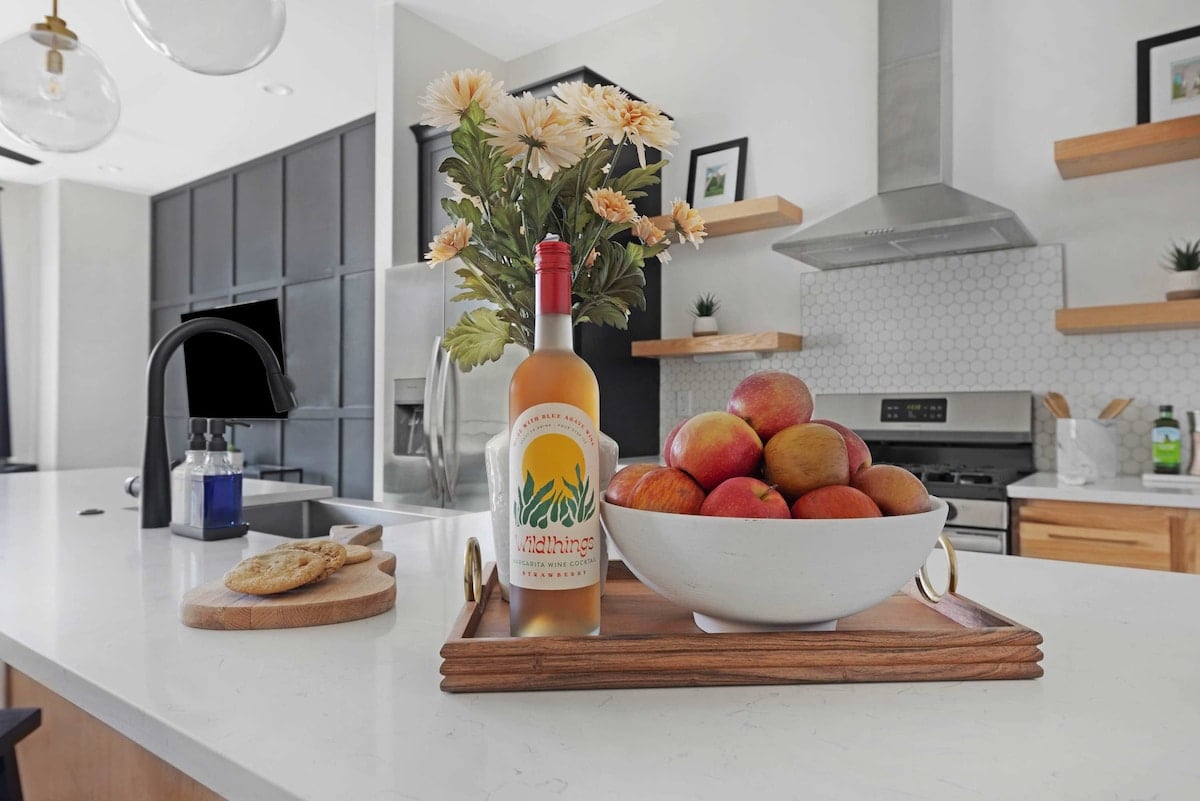 Fully Stocked Kitchen with Modern Appliances and Ample Storage
