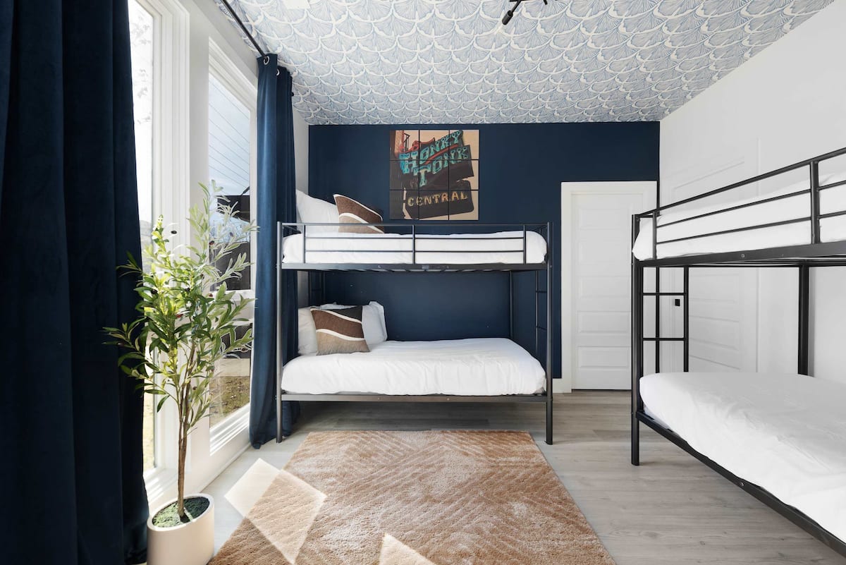 Cozy bedroom with two twin bunk beds (4 twin beds), a walk-in closet, and an en-suite bathroom with a shower for added convenience.