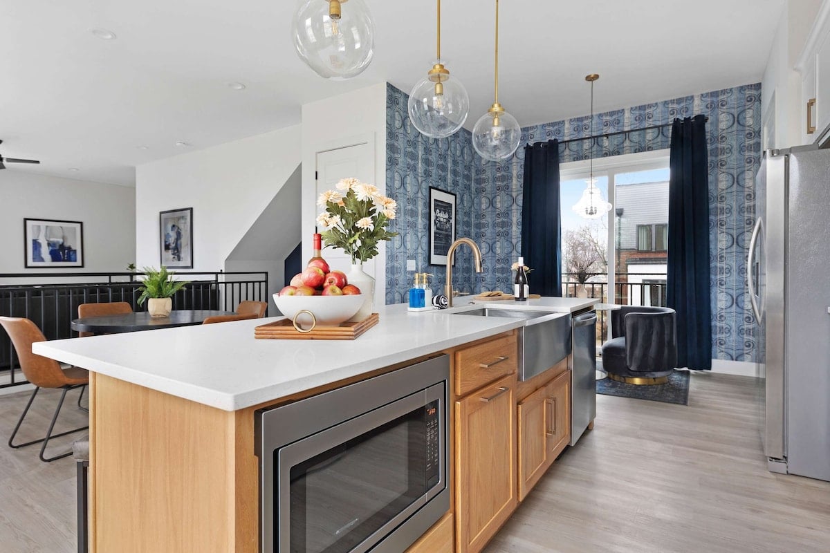 Fully Stocked Kitchen with Modern Appliances and Ample Storage
