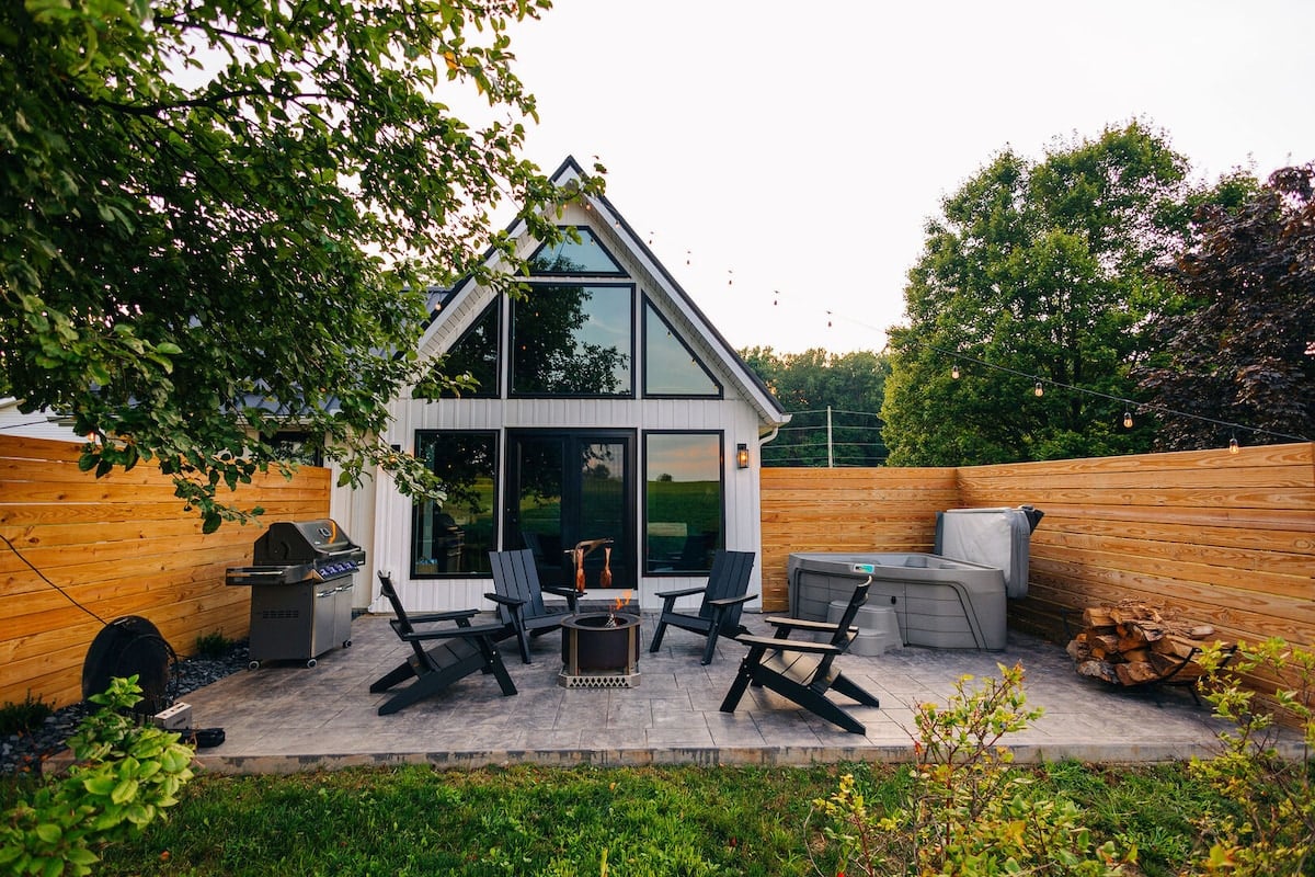 Enjoy this beautiful back deck with fire pit, gas grill, and HOT TUB!