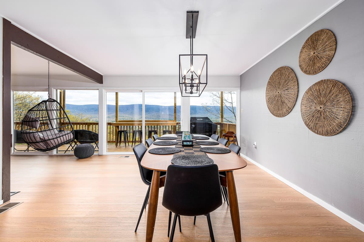 Dining room is right off the kitchen and seats 10 guests.
