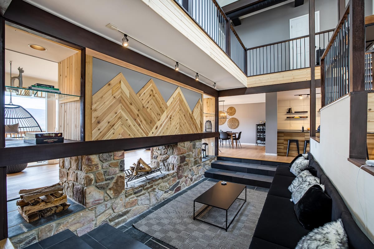 Main floor is an open floor plan with a large sunken seating area with open fireplace