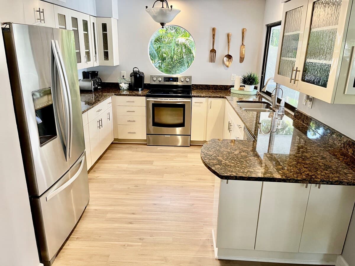 Fully equipped kitchen space with stainless steel appliances.