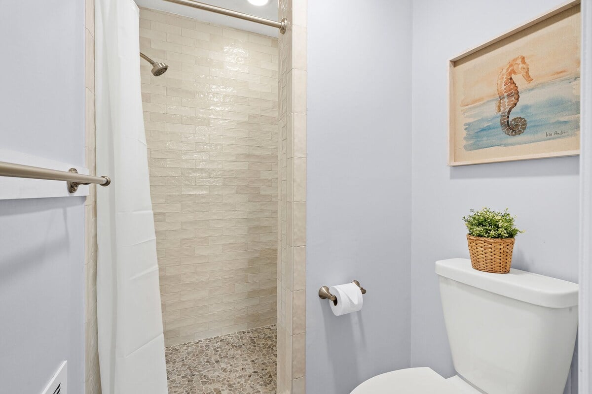 Walk-in tile shower.
