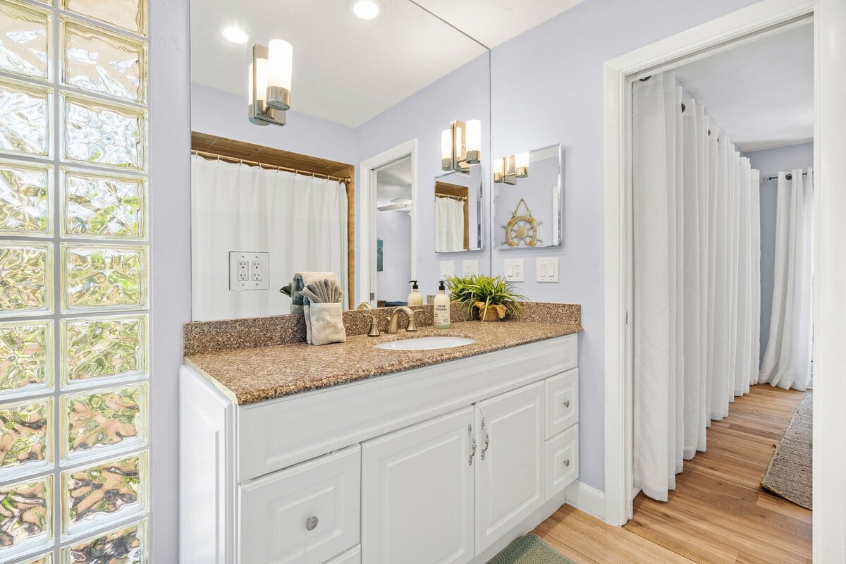 Jack and Jill full bathroom located on the first floor between bedroom 2 and 3.