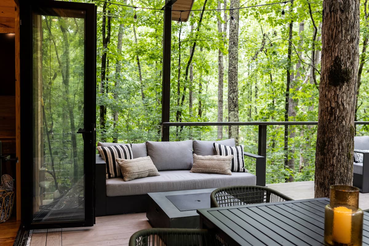 outdoor sofa & fire table with roasting skewers provided